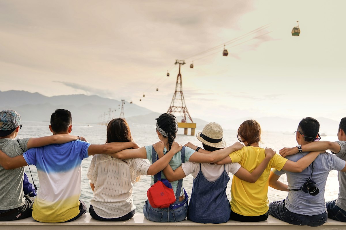 Friends gathering socially — stock ambiance, not residents of this community